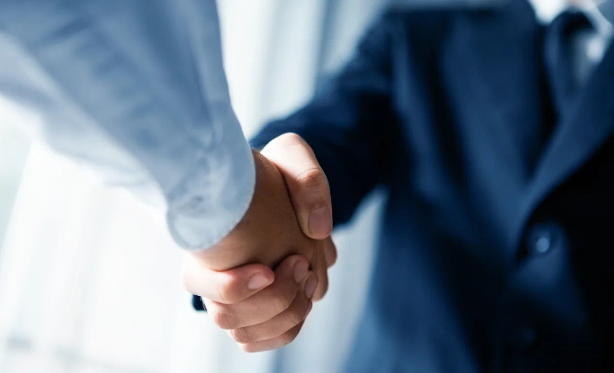 An outstretched hand offering a handshake
